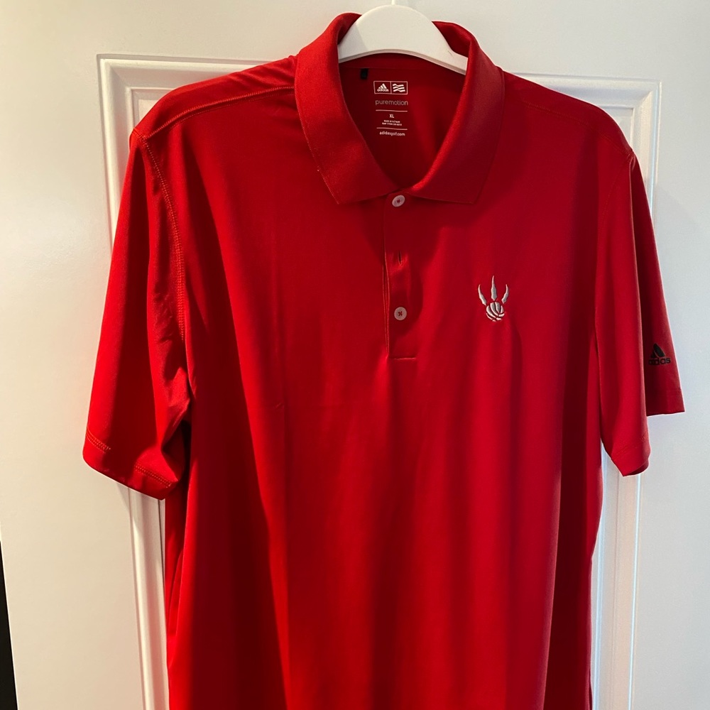Toronto Raptors Puremotion Golf Shirt.